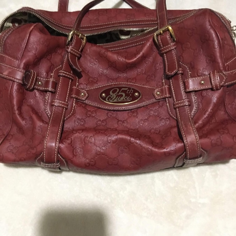 Avenue Women's Red Embossed Shoulder Bag, comes with a gold lock and a key